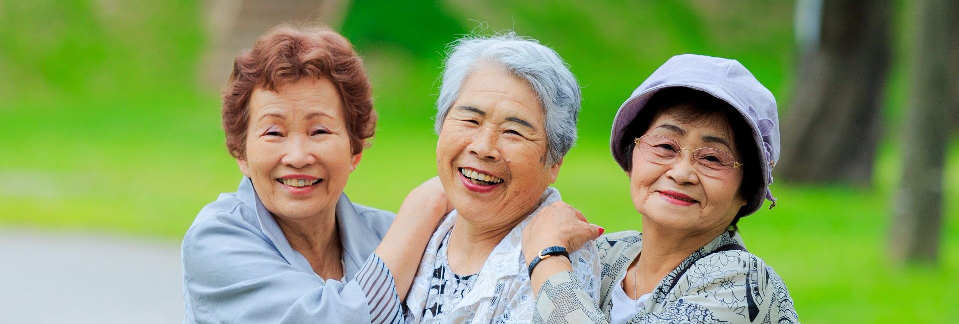 Three older women laughing